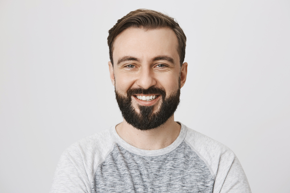 close-up-happy-laughing-bearded-man-smiling